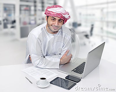 Arabian business man having coffee in his office