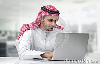 Arabian Business man using notebook in the office