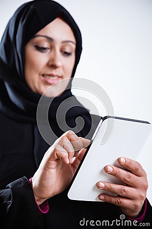 Arabic woman using digital tablet