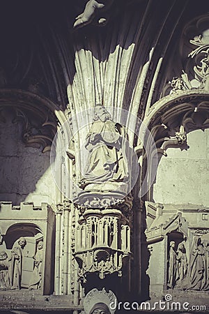 Arch with figures of Gothic style cathedral in Toledo Spain