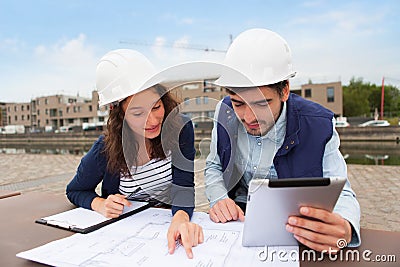 Architect woman and construction site supervisor