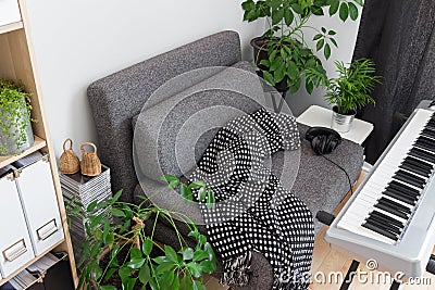 Armchair and electric piano in a musician s home