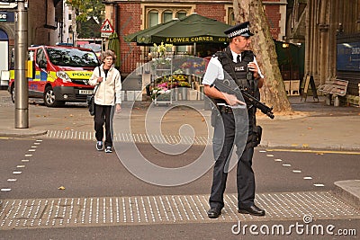 Armed police officer High Street Kensington London