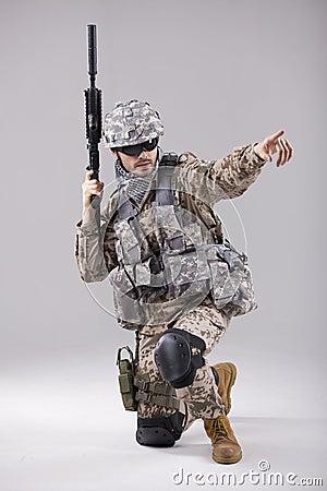 Armed Soldier pointing with finger