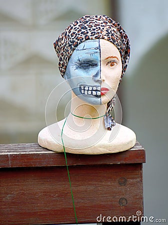 Artifical womens head with scary makeup