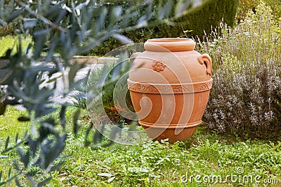 An artisan ceramic container in the garden