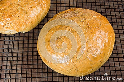 Artisan rosemary bread on cooling rack