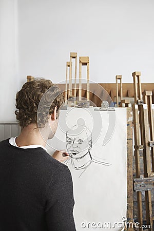 Artist Drawing Charcoal Portrait In Studio