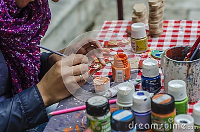 Artist painting dolls