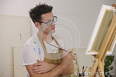 Artist painting model at art studio