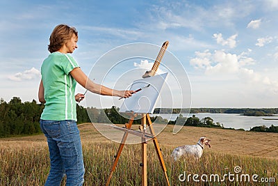 Artist painting an sea landscape