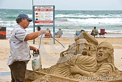 Artist works on beach