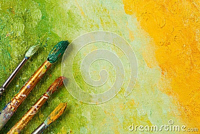 Artists brushes on artistic background