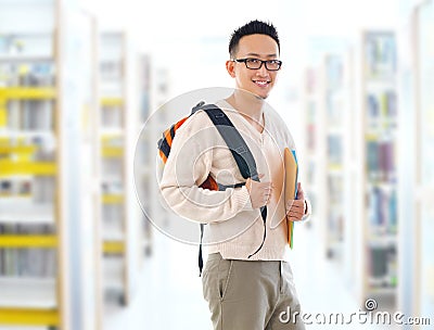 Asian adult student in library