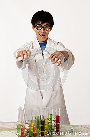 Asian boy pretending to be mad scientist
