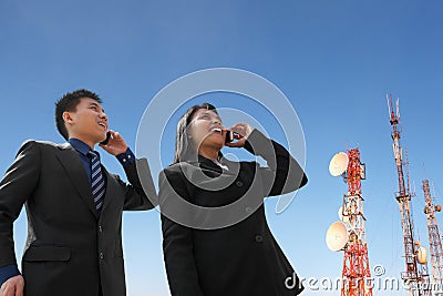 Asian business people on phone and antenna