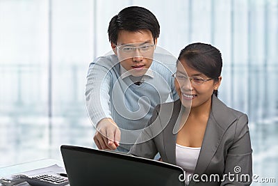 Asian business people working together