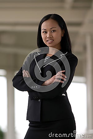 Asian Business Woman with Arms Folded Smiling