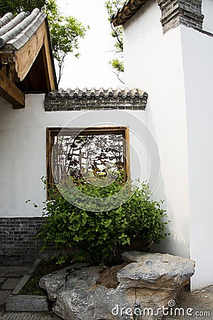 Asian Chinese antique buildings, white walls, tiles and wooden window