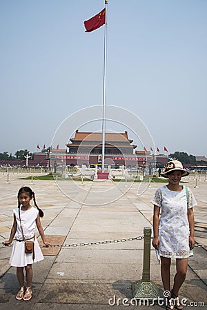 Asian Chinese, Beijing, The Tian anmen Rostrum, the national flag pole