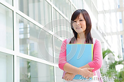 Asian chinese college female student with campus background