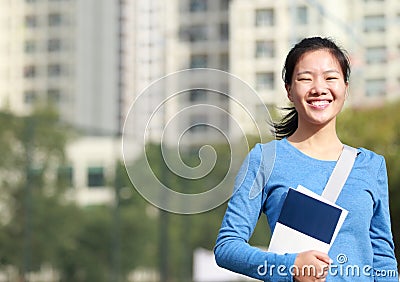 Asian college student with books