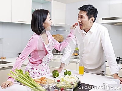 Asian couple in kitchen