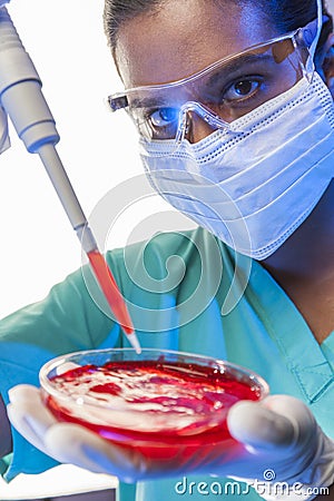 Asian Female Laboratory Scientist Using Pipette Blood Sample