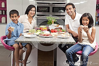 Asian Indian Parents Children Family Eating Meal