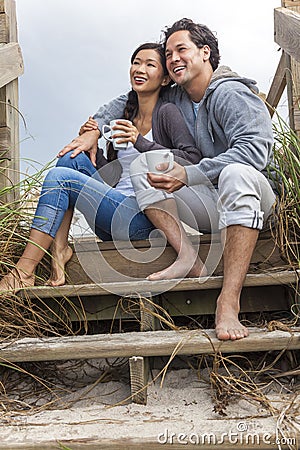 http://thumbs.dreamstime.com/x/asian-man-woman-romantic-couple-beach-steps-young-chinese-men-boy-girl-sitting-wooden-overlooking-drinking-mugs-tea-36791386.jpg