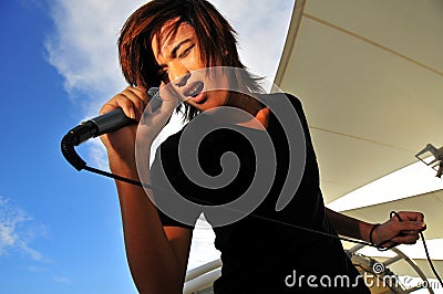 Asian Rock Star with microphone singing
