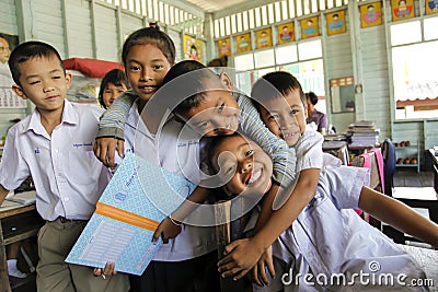 Asian School Group in uniform playing with camera