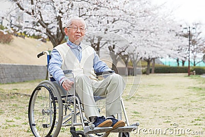 Asian senior man sitting on a wheelchair