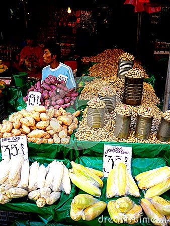 Asian street vendor selling fruits and vegetable in quiapo, manila, philippines in asia