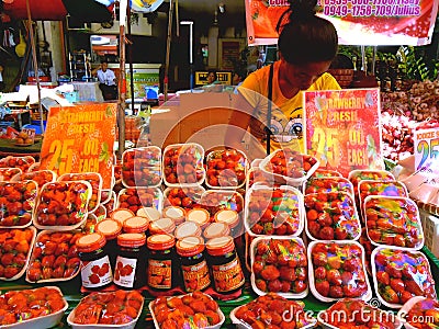 Asian street vendor selling strawberries in quiapo, manila, philippines in asia