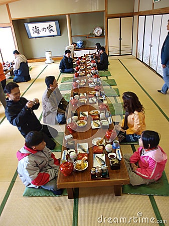 Asian tourist have lunch in Japanese restaurant