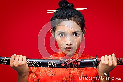 Asian woman holding a sword