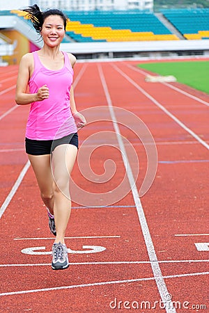 Asian woman runner running