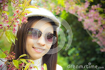 Asian women with pink cherry flower