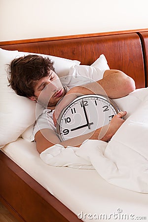 Asleep man with clock