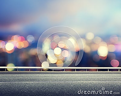 Asphalt road and blurred city