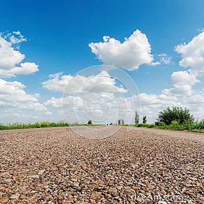 Asphalt road closeup under clouds