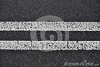 Asphalt road with white double
