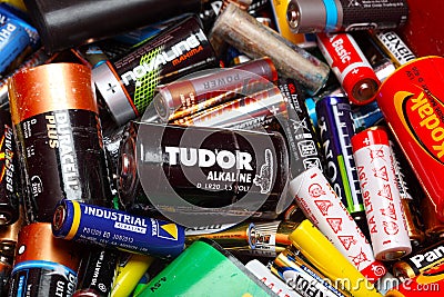 Assorted Household Batteries in garbage can