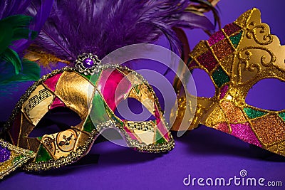 Assorted Mardi Gras or Carnivale mask on a purple background