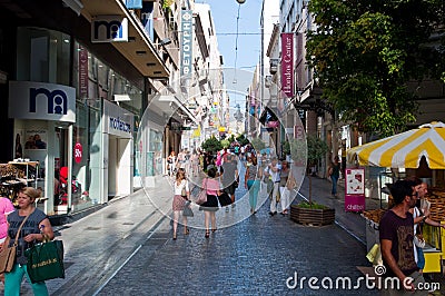 ATHENS-AUGUST 22: Shopping on Ermou Street with crowd of people on August 22, 2014 in Athens, Greece.