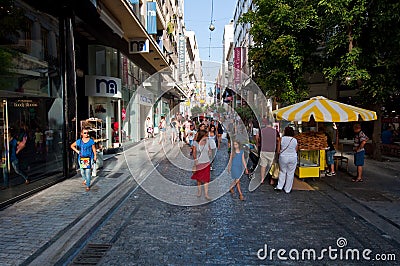 ATHENS-AUGUST 22: Shopping on Ermou Street with crowd of people on August 22, 2014 in Athens, Greece.