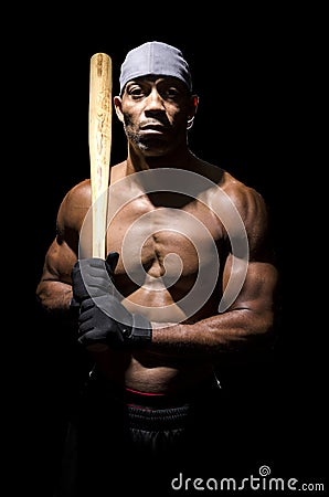 Athlete with baseball bat on shoulder
