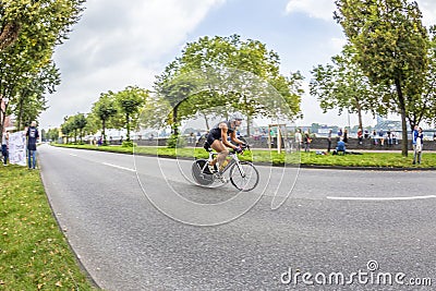 An athlete cycles in the Cologne