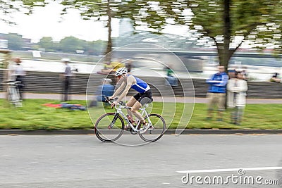 An athlete cycles in the Cologne